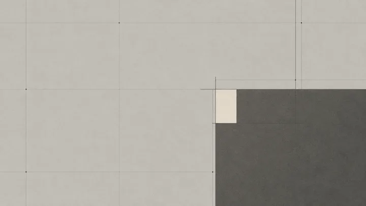 A drafting grid with a large rectangular block and a small beige inset